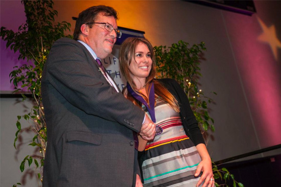 Amber Sims Hinterplatter CLU SOM Award All Stages Marketing Amber Sims Hinterplattner accepting award from CLU President Chris Kimball